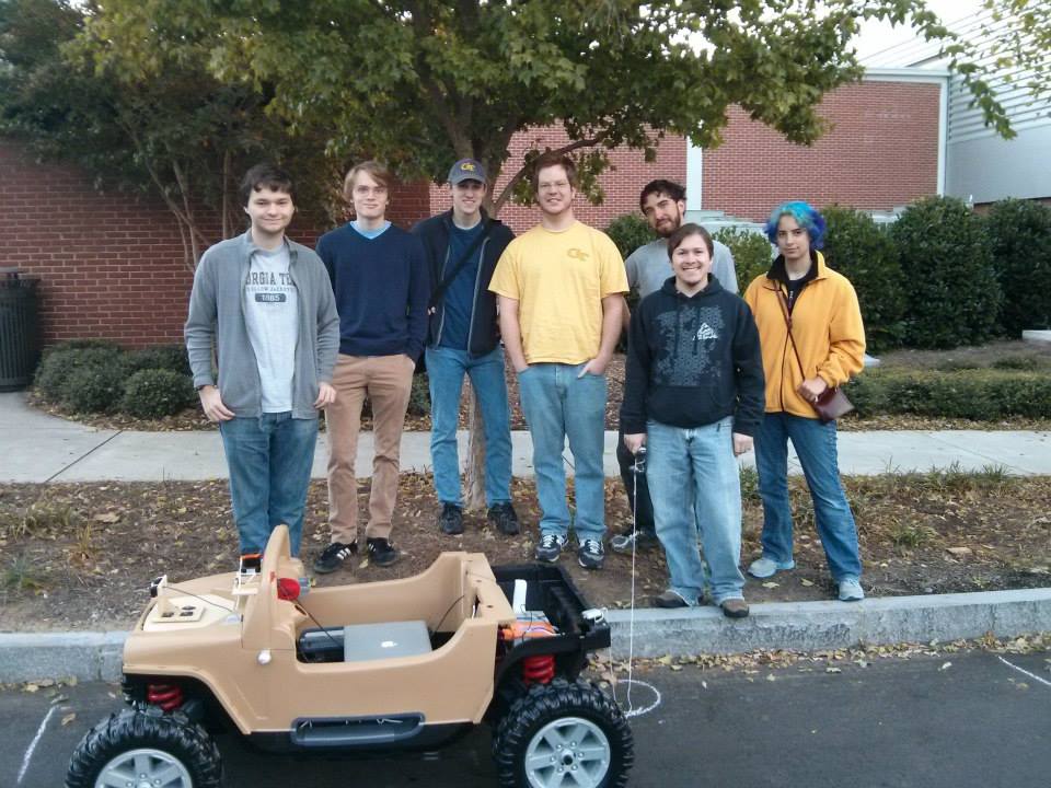 Club members Albert Morlan, Bill Dorn, Thomas Shields, Johnathan Suit, Alex Linton, Jesse Rosalia, and Rachel Rosalia (Clark) proudly show off Buzzmobile.